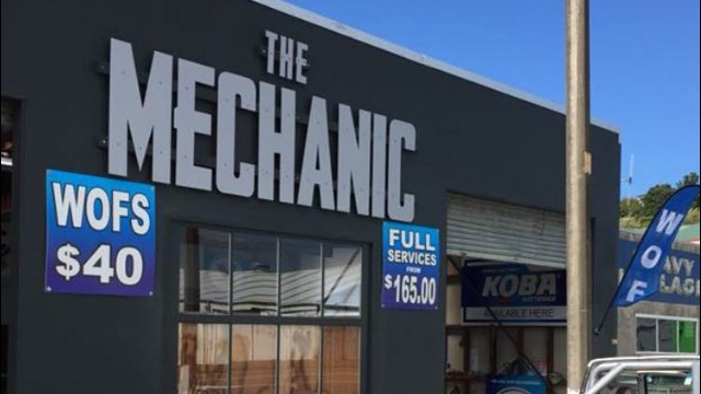 The Mechanic shopfront signage with WOF and service pricing
