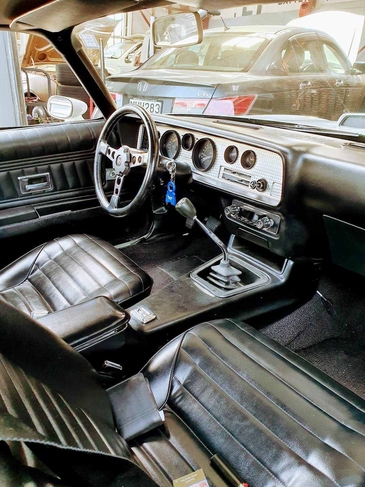 Classic car interior with manual shifter in the workshop